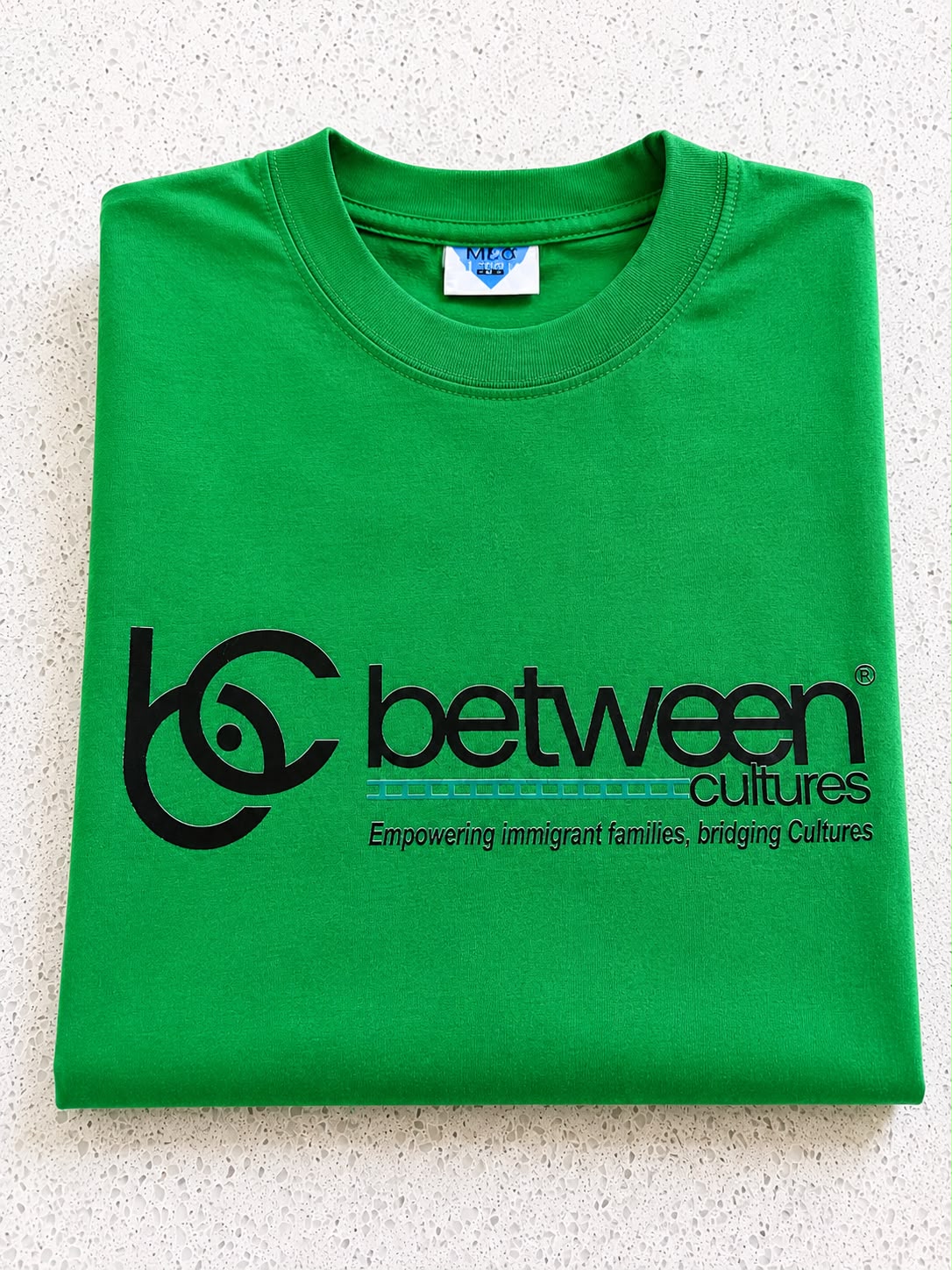Green round neck T-shirt.